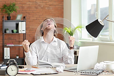 Happy businessman finishing his job in time Stock Photo