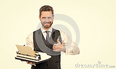 happy businessman hold retro typewriter and show thumb up isolated on white, litterateur Stock Photo