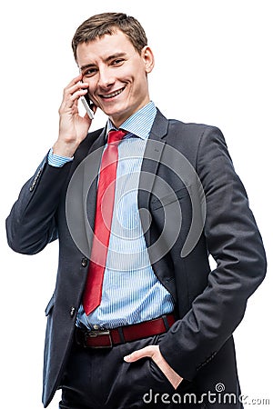 Happy businessman with phone posing on white Stock Photo