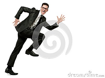 Happy businessman runs in black suit on white. Stock Photo