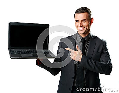 Happy businessman standing with laptop Stock Photo