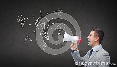 Happy businessman in suit speaking to megaphone Stock Photo