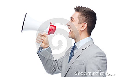 Happy businessman in suit speaking to megaphone Stock Photo