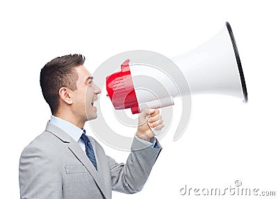 Happy businessman in suit speaking to megaphone Stock Photo
