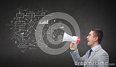 Happy businessman in suit speaking to megaphone Stock Photo