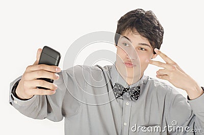 Happy businessman taking a selfie photo with his smart phone. Stock Photo