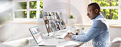 Happy Businessman Videoconferencing With His Colleagues Stock Photo