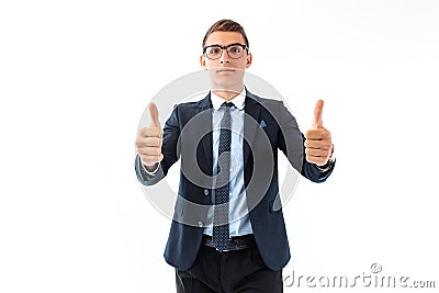 Happy businessman wearing glasses and suit showing the thumbs up Stock Photo