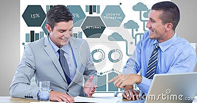 Happy businessmen discussing against graphics Stock Photo