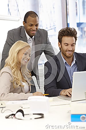 Happy businesspeople working together Stock Photo