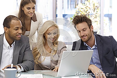 Happy businessteam working with laptop computer Stock Photo