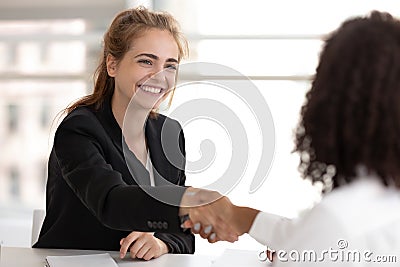 Happy businesswoman hr manager handshake hire candidate selling insurance services Stock Photo