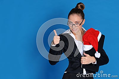Happy businesswoman with laptop, Christmas hat Stock Photo