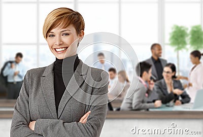 Happy businesswoman at office Stock Photo