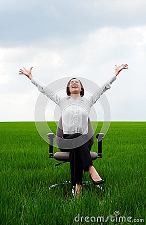 Happy businesswoman sitting on recliner Stock Photo