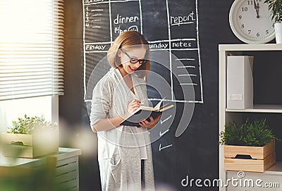 Happy businesswoman woman at school board with schedule planning Stock Photo