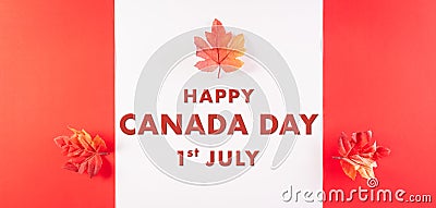 Happy Canada Day concept made from red silk maple leaves with the text on white and red background Stock Photo