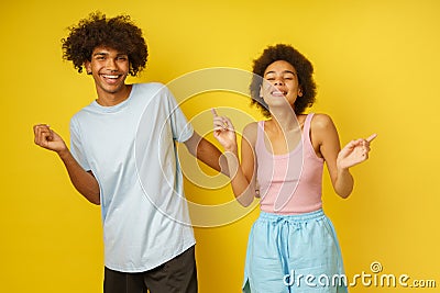 Happy and carefree boyfriend and girlfriend dance together Stock Photo