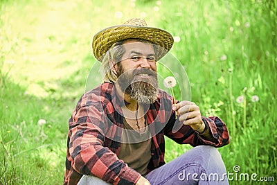 Happy and carefree life. Peace of mind. Rest and relax. Make wish. Peaceful man in straw summer hat. Bearded man blowing Stock Photo