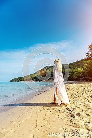 Happy Carefree Woman on the Beach Stock Photo