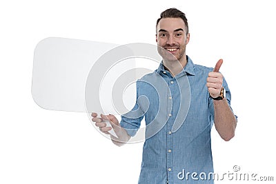 Happy casual holding blank speech bubble, gesturing ok and smiling Stock Photo