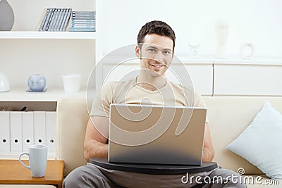 Man using laptop at home Stock Photo