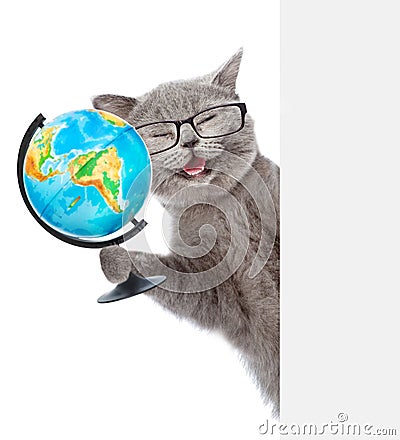 Happy cat in glasses holding globe and peeking from behind empty board. isolated on white background Stock Photo