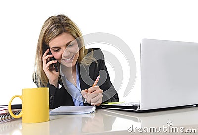 Happy Caucasian blond business woman working talking on mobile phone Stock Photo