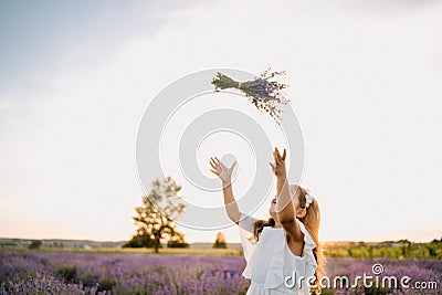 Happy Caucasian Girl with Violet Lavender Bouquet Stock Photo