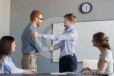 Happy ceo handshaking successful employee supporting congratulat Stock Photo