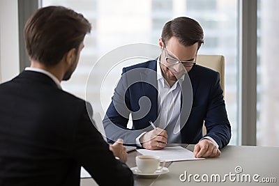 Happy CEO sign business contract closing deal with partner Stock Photo