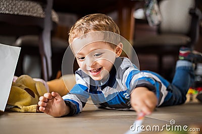 Happy cheerful child playing at home Stock Photo