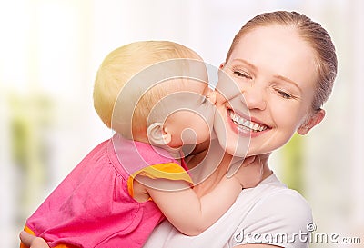 Happy cheerful family. Mother and baby kissing Stock Photo