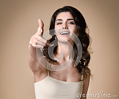 Happy cheerful girl pointing finger at camera isolated Stock Photo