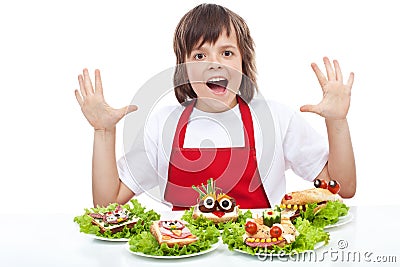 Happy chef with creative food creature sandwiches Stock Photo