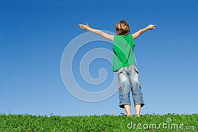 Happy child arms raised Stock Photo