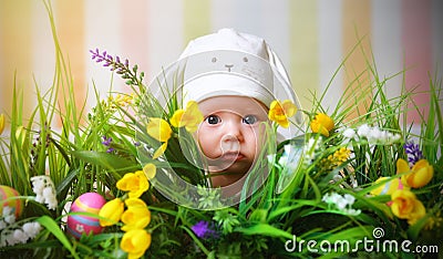 Happy child baby dressed as the Easter bunny rabbit on the grass Stock Photo