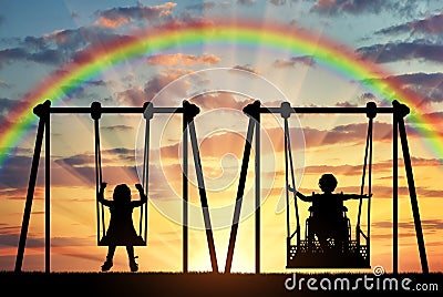 Happy child is a disabled person in a wheelchair riding an adaptive swing next to a healthy child together Stock Photo