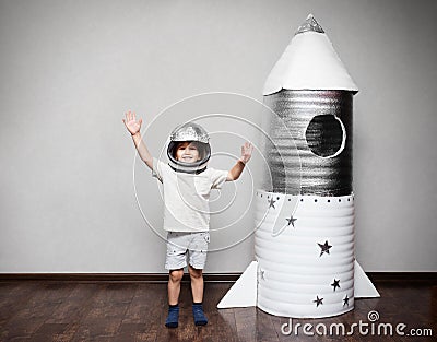 Happy child dressed in an astronaut costume Stock Photo