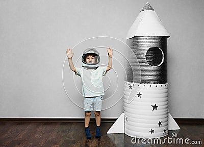 Happy child dressed in an astronaut costume Stock Photo