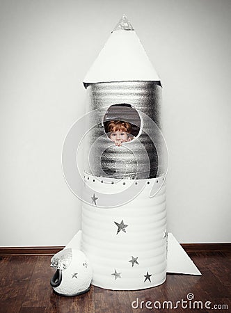 Happy child dressed in an astronaut costume Stock Photo