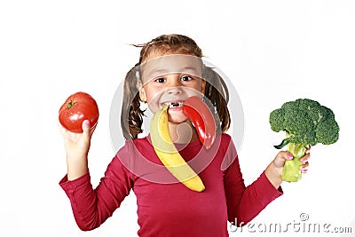 Happy child eating healthy food vegetables Stock Photo