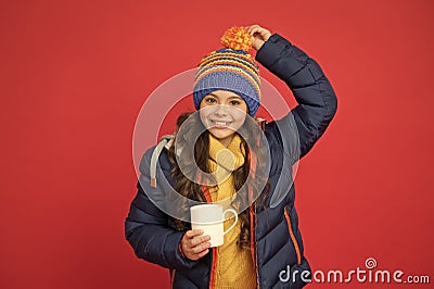 Happy child enjoy drinking tea or coffee. Little girl hold drinking mug. Healthy drinking habits. Drinking cocoa or Stock Photo