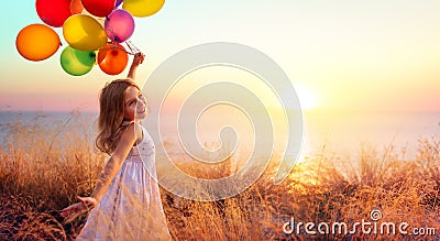 Happy Child In Freedom With Balloons Stock Photo