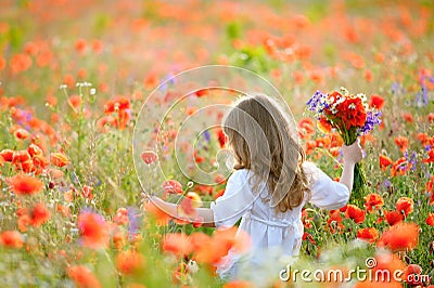 Happy child girl with field flowers running on meadow in summer Stock Photo