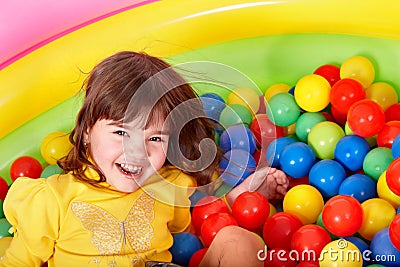 Happy child in group colourful ball. Stock Photo