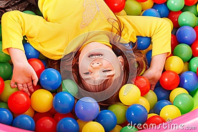 Happy child in group colourful ball. Stock Photo