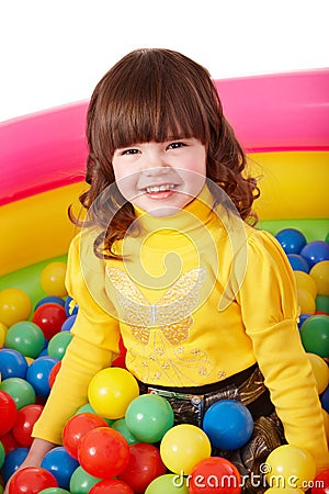 Happy child in group colourful ball. Stock Photo