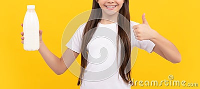 happy child hold dairy beverage product. teen girl going to drink milk. healthy lifestyle. Stock Photo