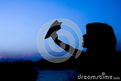 Happy child holding flightnumber silhouette on nature in the park sunset Stock Photo